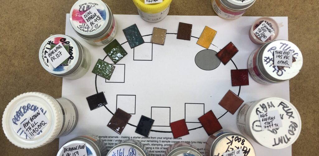 Testing samples of enamel to create colour palettes on the Advanced enamelling course at Rainbow Glass Studios London