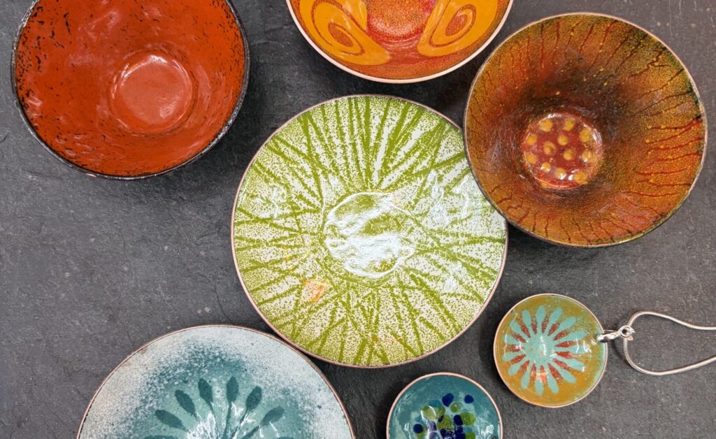 collection of enamelled bowls made by students at Rainbow Glass Studios London