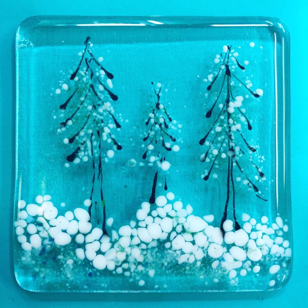Fused Glass Snow scene coaster made by a student at Rainbow Glass Studios on our festival day course