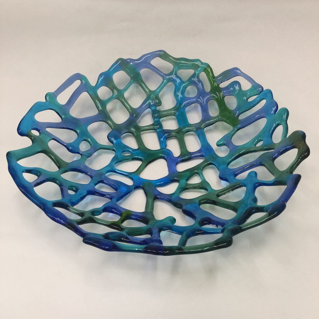 Coraline bowl, made in blues, greens and turquoise fused glass, an organic way to work with fused glass giving holes like netting, beautiful and fragile