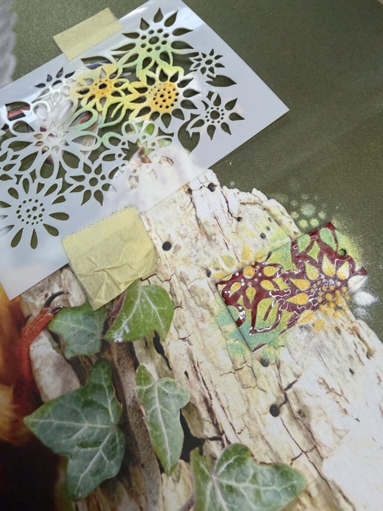 The stencilling process at Rainbow Glass Studios as enamel is applied through the stencil's holes onto the pendant